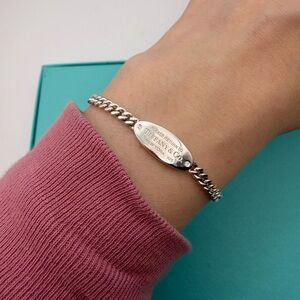 Tiffany & Co. New 7.5” approx rtt oval ID bracelet in sterling silver